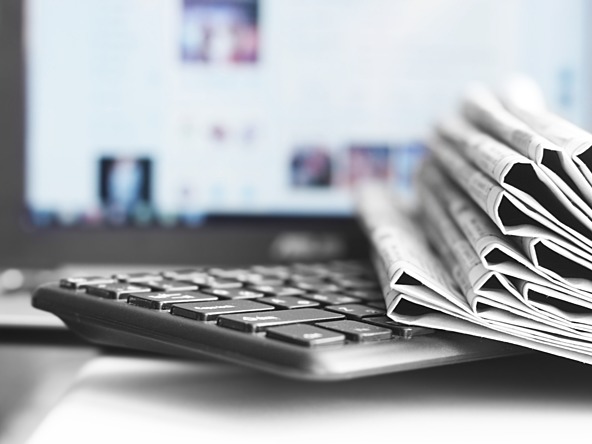 tradition newspaper with modern tech